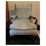 Upholstered armchair with doily
