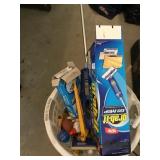 Basket of cleaning products and mop