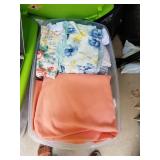 Plastic bin of bed linens