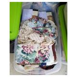 Plastic bin of curtains