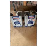 Two cans of Husqvarna pre mix fuel+oil
