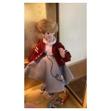 Shelf lot of porcelain dolls , religious figure,