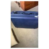 Samsonite blue suitcase , pillow