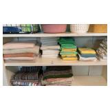 Shelf lot of towels and rags