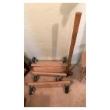 Sledgehammer and caster wheels on wood