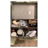 Metal tool box with plumbing supplies