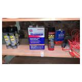 Shelf lot of bug spray, work light