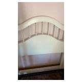 Pair of white twin beds with frames