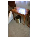 Low stand, brass waste can,  pillow