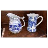 2 blue & white pitchers