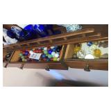 Lot of marbles in 3 mini drawers left wall shelf