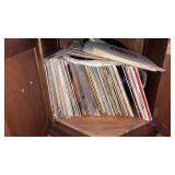 Lot of record albums and 45s in stand