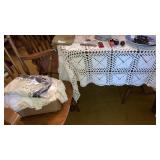 Crocheted tablecloth on table &Box of crocheted
