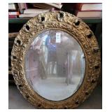 Framed oval mirror