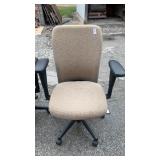 2 Tan office chairs on rollers