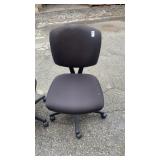 2 black office chairs on rollers