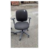 2 black office chairs 2 different sizes
