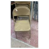 2 brown folding chairs , 2 blue folding chairs