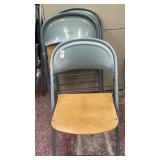 4 blue folding chairs