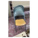 4 blue folding chairs