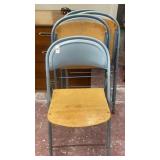 4 blue folding chairs