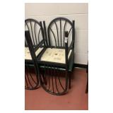8 metal chairs with green cushions