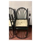 8 metal chairs with green cushions