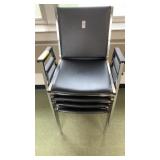 4 black padded metal chairs
