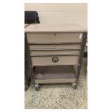 Napa toolbox with drawers and top lid opens , on