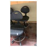2 black adjustable desk chairs