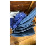 Large bin of cushions and blanket