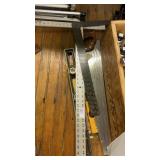 Lot of T squares, levels, and a craftsman saw