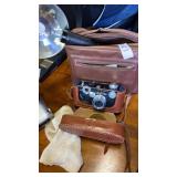 Argus camera in carrying case and camera bag with