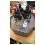 Oriental figures and metal container