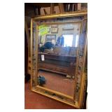 Mirror with decorated frame