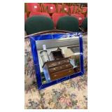 Mirror with blue stained glass frame