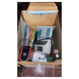 Box of office desk goods paper dolls sharpener