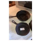 2 small cast iron skillets
