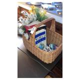 Basket w/batteries,reference books, florals