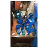 Large lot of aqua glass Fenton goose girl cat