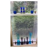 Aqua & amethyst glass on side window sill