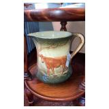 Antique cow pottery pitcher