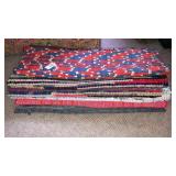 Stack of woven rag rugs