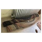 2 large oval braided rugs