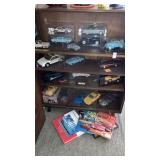 Large lot of car models in bookcase,books, signed