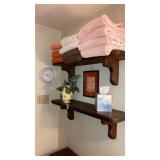 Bath towels hamper contents of vanity decoratives