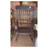 Antique pressed back rocker curved arms