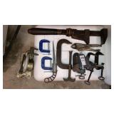 Small vise, Big pipe wrench, C-clamps, saw tool