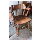 Wooden captains chair on casters