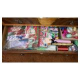 Drawer lot wrapping paper ribbon bows gift bags